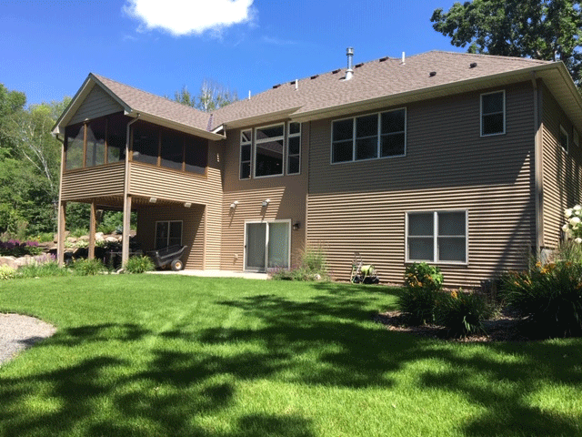 Exterior 2 story tan house